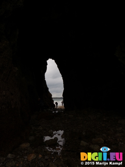 FZ021515 Hans, Machteld and Jenni exploring cave under St Catherine's Island, Tenby